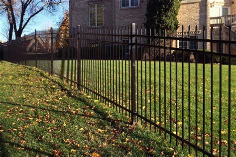 Classic style ornamental steel fence. Designed and installed by First Fence Company in Hillside ...