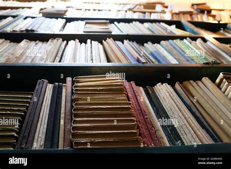 Many books on bookshelf in library Stock Photo - Alamy