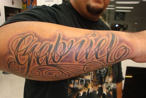 Wonderful name quote tattoo for men on arm - Tattooimages.biz