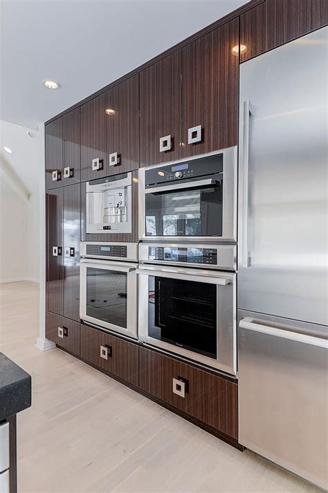 Wall of Kitchen Cabinets Features Built-In Appliances | Built in kitchen appliances, Kitchen ...