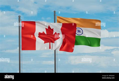 India flag and Canada flag waving together on blue sky, two country ...