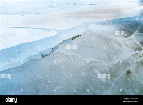 Lake ice crack - Close up view of cracking ice at the surface of a ...