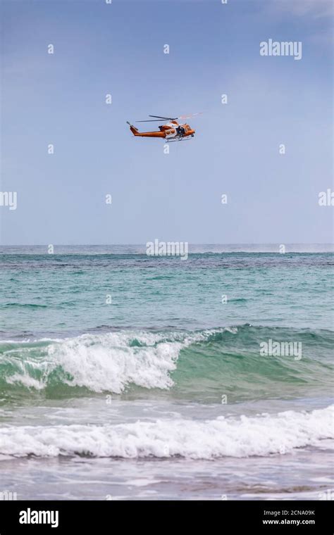 Rescue helicopter training over sunny ocean, Adelaide, Australia Stock ...