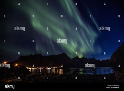 Northern lights above Reine in Lofoten islands in Norway Stock Photo ...