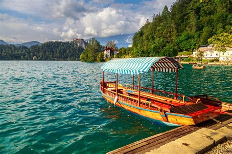 Traditional Wooden Boats Pletna on Lake Bled Stock Image - Image of mountain, castle: 67666815