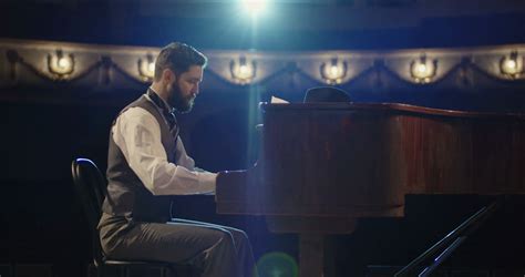 Medium Shot Of Man Playing Piano On Stage Stock Footage SBV-330428887 - Storyblocks