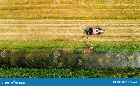 Drainage Ditch Cleaning with Tractor. Aerial View Stock Image - Image ...