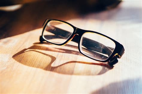 Black Framed Wayfarer Eyeglasses on Book · Free Stock Photo