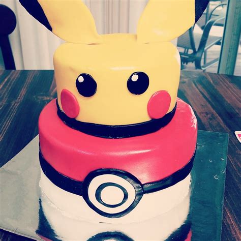 Pikachu pokeball cake! White cake pokeball, chocolate cake pikachu, butter cream frosting on ...