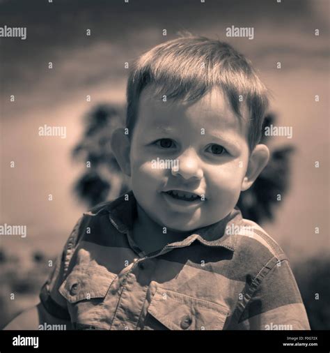 Portrait of cute smiling child boy outdoors Stock Photo - Alamy