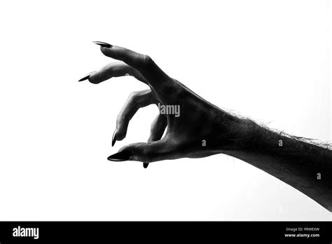 Black creepy halloween monster hand with long nails Stock Photo - Alamy