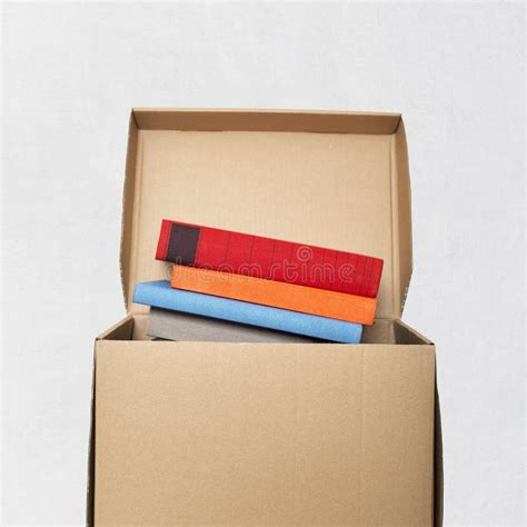 Packing Books In A Cardboard Box Stock Photo - Image of package, packaging: 116696156