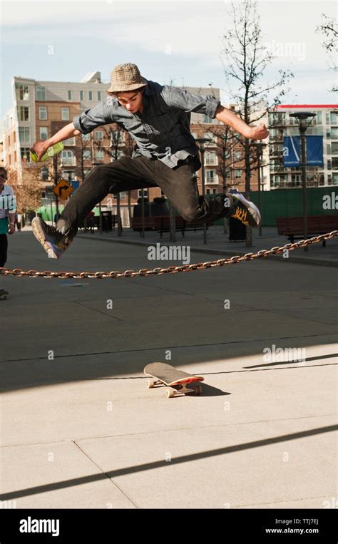 Man jumping over fence hi-res stock photography and images - Alamy