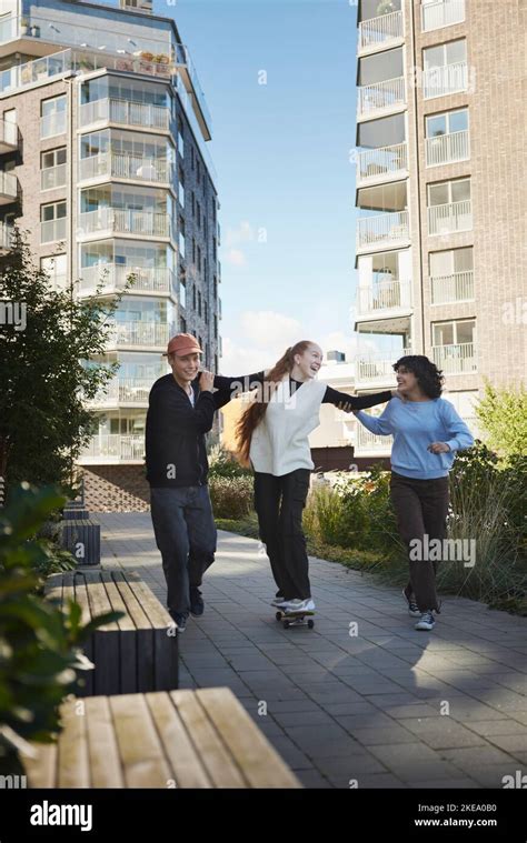 Friends hanging around together Stock Photo - Alamy