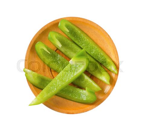 Slices of fresh green bell pepper on ... | Stock image | Colourbox