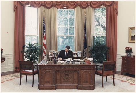 File:Photograph of President Reagan working at his desk in the Oval Office - NARA - 198593.jpg