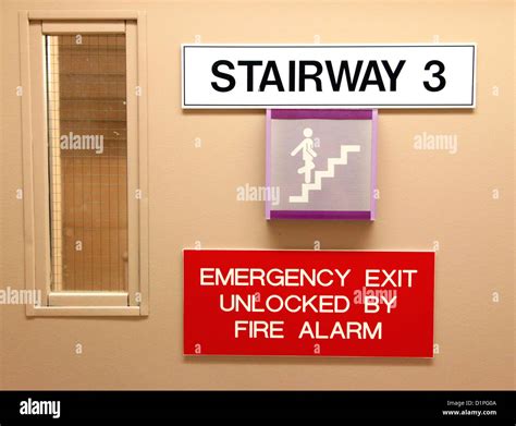 Emergency Exit and Stairway Sign Stock Photo - Alamy