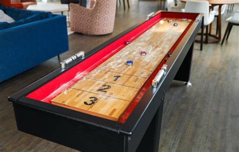 Premium Photo | A game table in a living room with a red table that says 3 and 3.