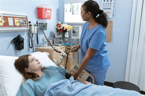 Nurse measuring the Blood Pressure of a Patient · Free Stock Photo