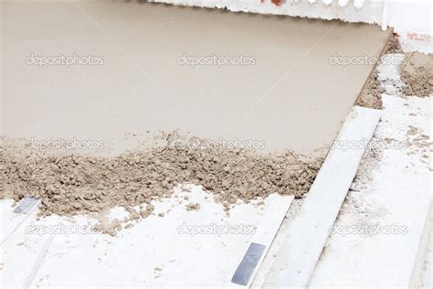 Preparing a cement screed Stock Photo by ©Chretien 28881327