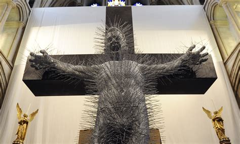 Jesus on the cross sculpture made entirely of coat hangers depicts agony of Christ | Daily Mail ...