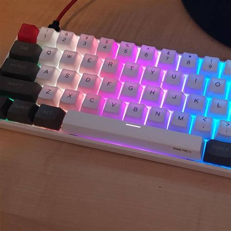 a white keyboard with red and blue lights on it