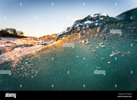 wave at sunrise Stock Photo - Alamy