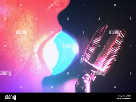 Singer with microphone Stock Photo - Alamy