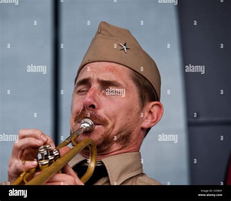 The lead singer and trumpet player in a small jazz band, playing live music Stock Photo - Alamy