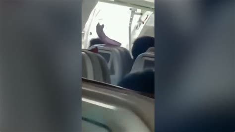 Terrifying moment plane door opens mid-flight