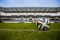 Soccerball on Wide Green Grass Field · Free Stock Photo