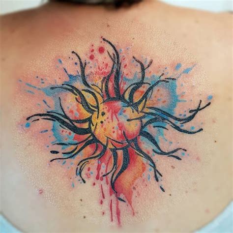 Colorful Realistic Sun Tattoo On Upper Back For Women | Rainbow tattoos ...