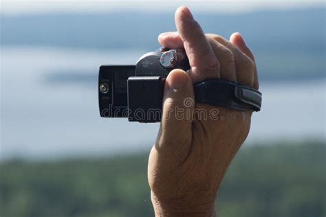 Camera Hand Held while Filming Stock Image - Image of background, strap ...