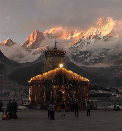 'Kedarnath temple lit up beautifully as the final rays of the setting sun light up the snow-clad ...