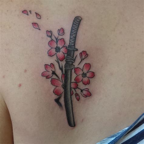 Cherry blossom with sword tatoo | Small tattoos, Cherry blossom tattoo, Blossom tattoo