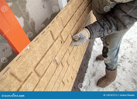 Installing Brick Siding on the Wall of the House Stock Image - Image of house, decoration: 142767213