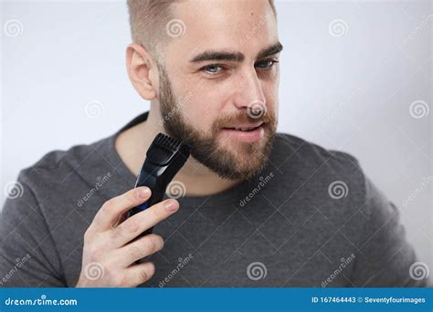 Handsome Man Grooming His Beard Stock Image - Image of face ...