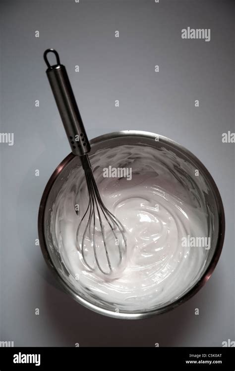 Whisking egg whites Stock Photo - Alamy