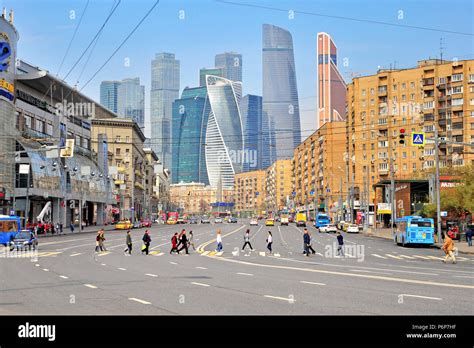 MOSCOW, RUSSIA - MAY 02: People crossing road in Moscow downtown near Moscow city district on ...