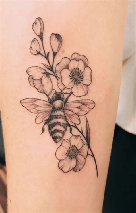 Bumble bee and flowers tattoo | Flower wrist tattoos, Bumble bee tattoo ...