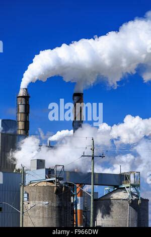 Air pollution from smokestacks at a pulp and paper mill, Terrace Bay, Ontario, Canada Stock ...