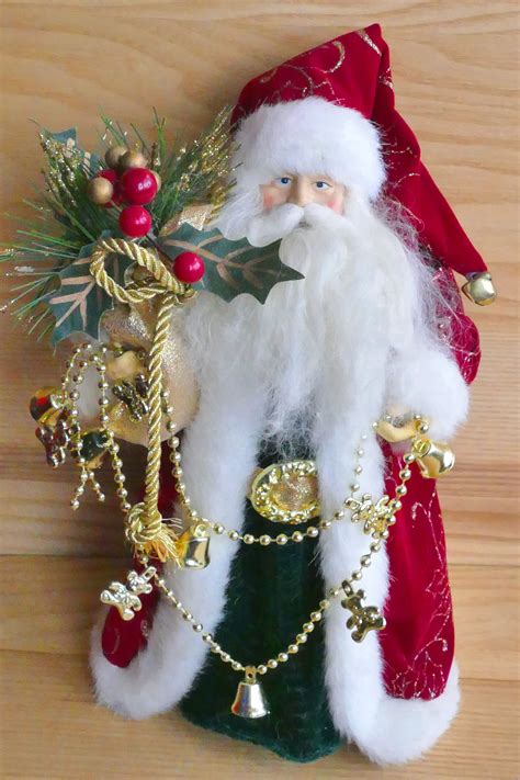 Santa Claus Holding Mistletoe Ornament · Free Stock Photo