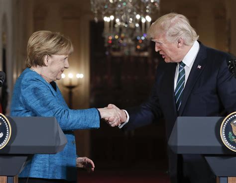 The Internet reacts to Trump and Merkel's awkward handshake moment ...