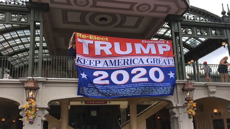 Man hangs Trump re-election banner at Magic Kingdom