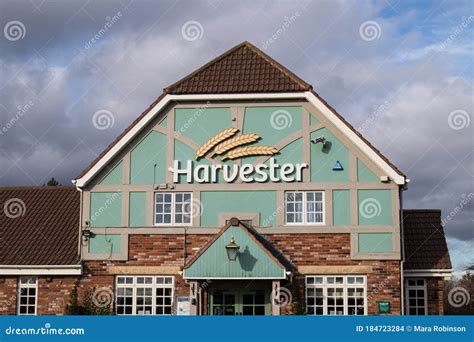 Exterior Outside Shot of Harvester Family Restaurant Pub Chain Showing Entrance and Company Sign ...