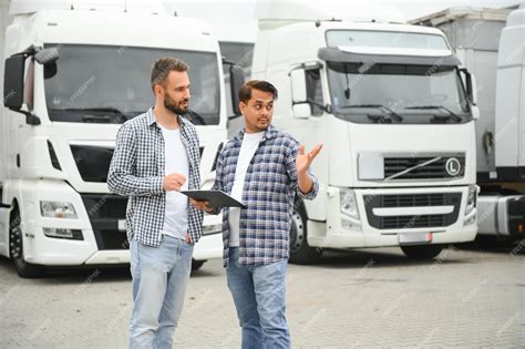 Premium Photo | The truck driver receives documents for the cargo and ...