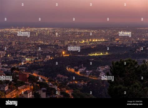 Barcelona city night view lights on top of Mount Tibidabo at blue hour ...