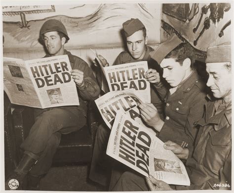 American soldiers reading about Hitler's death in the newspaper. The title alone takes up half a ...