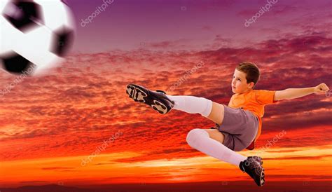 Soccer player doing flying kick with ball against a dramatic sk — Stock Photo © cristovao #9359712