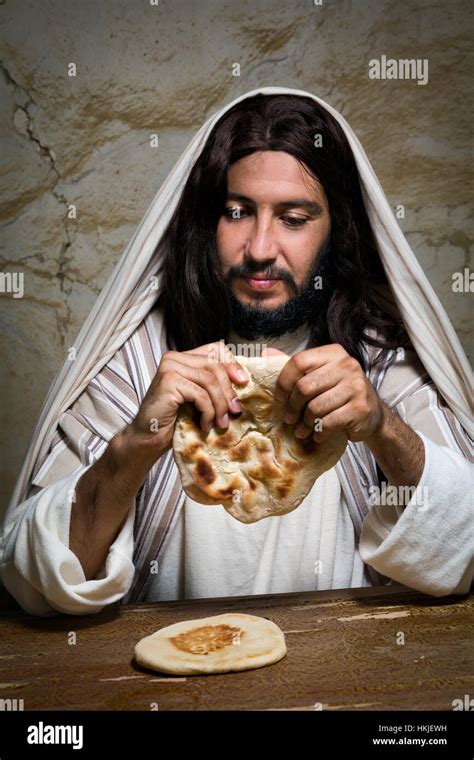 Jesus hands breaking bread hi-res stock photography and images - Alamy